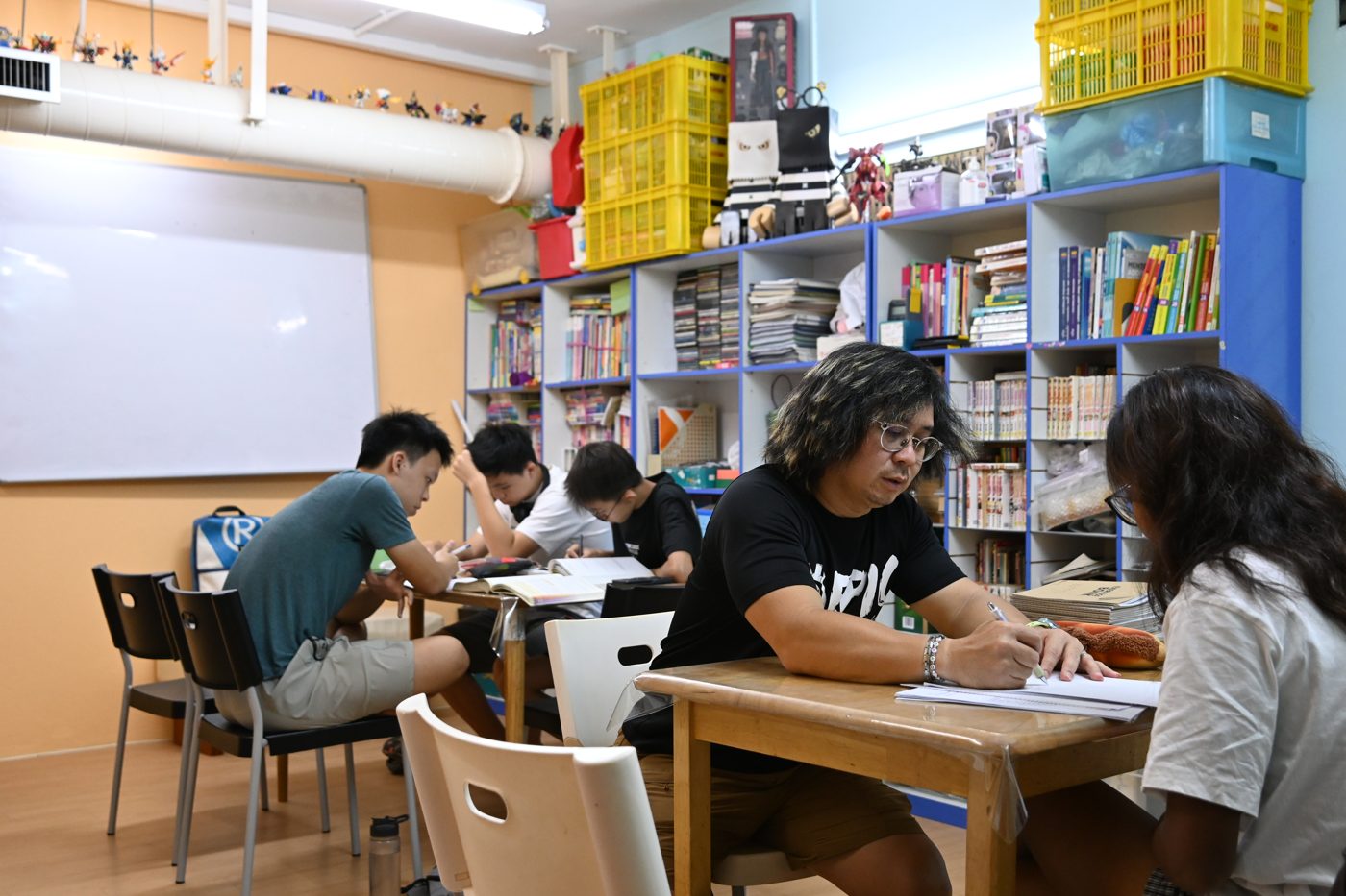 Tutor working through a paper with a student